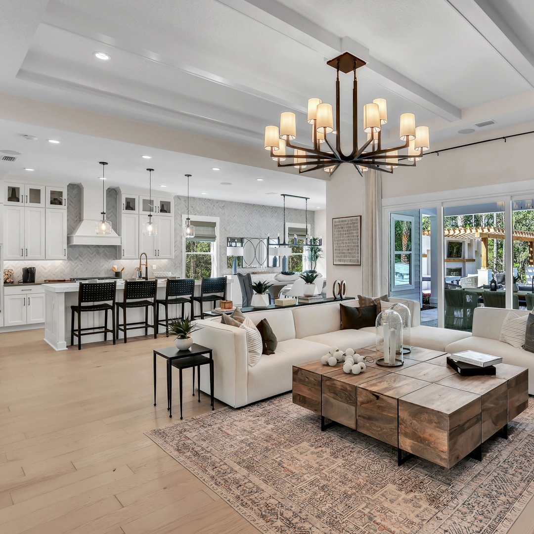 Coral ridge at Seabrook great room interior with large sofa and eat in kitchen with modern amenities.