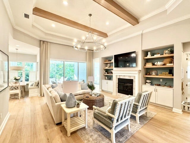 Living Room interior with a view of the tan and white kitchen